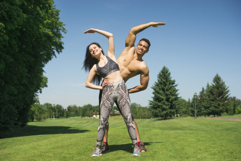 About man-woman-practicing-yoga-outdoor